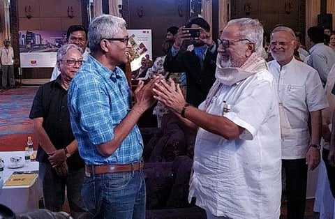 Odisha Governor Prof Ganeshi Lal, and Columnist and Author Ashutosh at Odisha Lit Fest 18. (Photo: Twitter / @OdishaLitFest18)