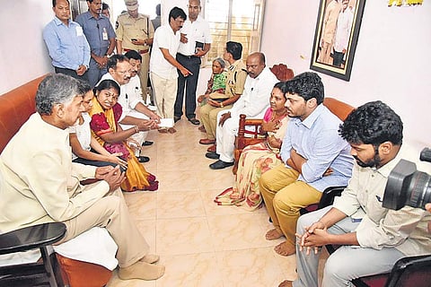 Chief minister N Chandrababu Naidu with family members of Araku TDP MLA Kideri Sarveswara Rao at the latter’s residence at  Paderu at Visakhapatnam district on Friday; (below) Naidu consoles son of the MLA  | Express