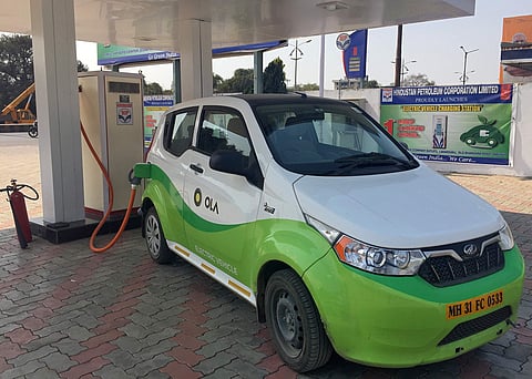 Mahindra's, e2oPlus, operated by Indian ride-hailing company Ola, is seen at an electric vehicle charging station in Nagpur, India. (Photo | Reuters)