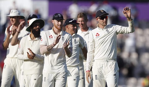 England's Joe Root, right,leads his players from the pitch after England defeated India on the fourth day of the 4th cricket test match between England and India. (Photo | AP)