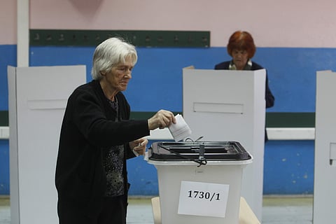 A woman casts her ballot at a polling station during a referendum in Skopje, Macedonia, Sunday, Sept. 30, 2018. (Photo | AP)