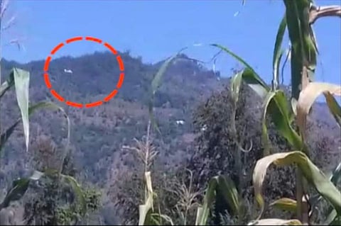 A video grab of the Pakistani chopper seen along the Line of Control in Jammu and Kashmir. (ANI)