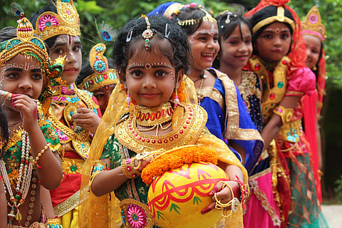 Children dressed up as little Radha and Krishna at the Sri Krishna Janmashtami celebrations held by Srikrishna vidya mandir in Visakhapatnam on Monday.( Photo | Express Photo Service/G satyanarayana)