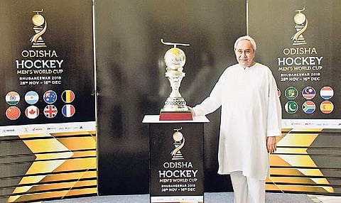 CM Naveen Patnaik with a replica of Odisha Hockey Men’s World Cup trophy in Bhubaneswar on Tuesday I Irfana