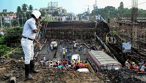 Rescue workers remove debris of the collapsed Majerhat bridge in Kolkata Tuesday Sep 04 2018. | PTI