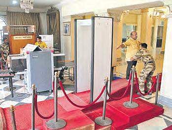Security guards frisk visitors at Salar Jung Museum. (right) Official sleeping on the job  at State Museum | R Satish Babu, Express