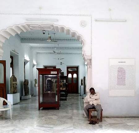 A guard found sleeping at the State Museum in Hyderabad's Nampally. (Photo | EPS)