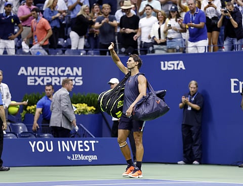 Rafael Nadal, of Spain, waves to fans after retiring from a match against Juan Martin del Potro, of Argentina, during the semifinals of the U.S. Open tennis tournament, Friday, Sept. 7, 2018, in New York. | AP