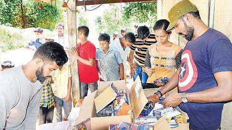 Indus Cycling Embassy members distributing school kits to children of flood-hit areas in Idukki