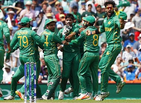 Pakistan Team celebrating the fall of an Indian wicket during the Champions Trophy Final.( Photo | AP)