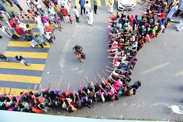 Men were seen in the opposite side of the road in solidarity with the women who participated in the wall.