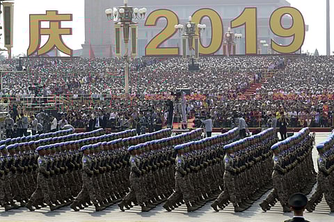 Members of a Chinese military honor guard march during the the celebration to commemorate the 70th anniversary of the founding of Communist China in Beijing. ( Photo | AP )