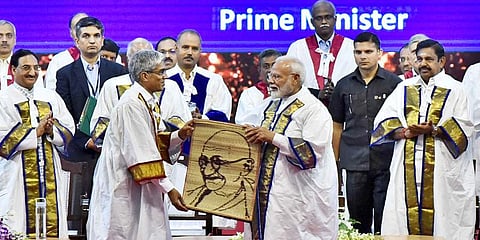 Prime Minister Narendra Modi being presented a memento depicting Mahatma Gandhi by IIT Madras director Bhaskar Ramamurthy L during the 56th annual convocation of IIT Madras. (Photo | P Jawahar, EPS)