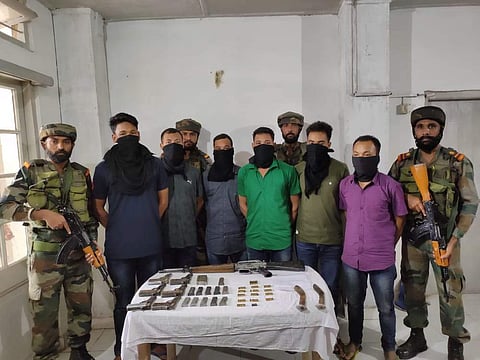 Security forces with apprehended NDFB insurgents in Assam.