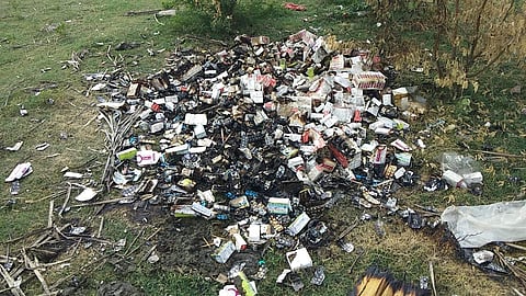 Medical wastes being dumped in the  Tiruneermalai lake. ( Photo | Special Arrangement )