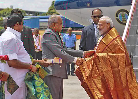 Prime Minister Narendra Modi being received by the Governor of Tamil Nadu, Banwarilal Purohit and the Chief Minister of Tamil Nadu, Edappadi K. Palaniswami, on his arrival, in Chennai. (Photo | PIB)
