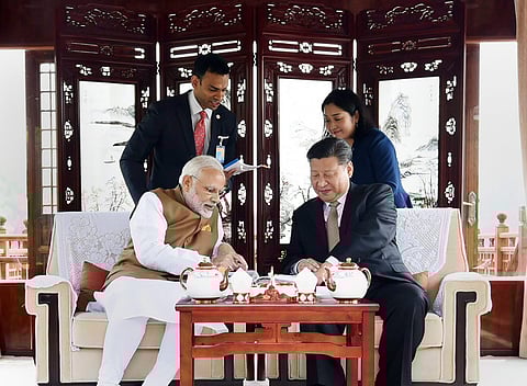 Prime Minister Narendra Modi with Chinese President Xi Jinping inside a house boat, in Wuhan. (File Photo | PTI)