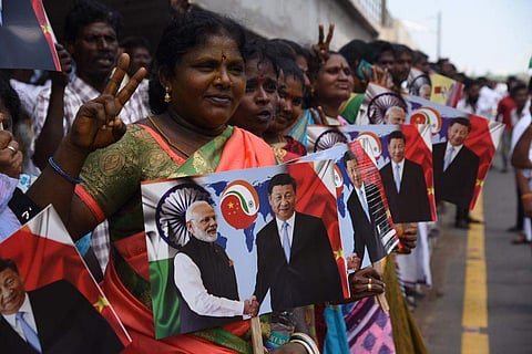 People waiting near airport for the arrival of Chinese President Xi Jinping, in Chennai on Friday (Express Photo| R Satish Babu)