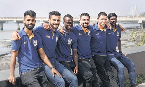 (from L) Mumbai’s Mohammed Rafique, Pratik Chaudhari, Modou Sougou, Paulo Machado, Amine Chermiti & Rowllin Borges in Mumbai, on Friday | PTI