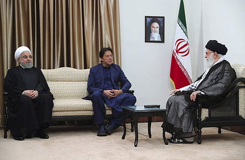 Iranian Supreme Leader Ayatollah Ali Khamenei (R) meets Pakistani Prime Minister Imran Khan (C)  with Iranian President Hassan Rouhani in Tehran (Office of the Iranian Supreme Leader via AP)