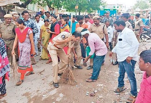 Police personnel participating in Swachh Bharat programme at Pinnelli village in Machavaram mandal of Guntur district on Saturday. (Photo | EPS)