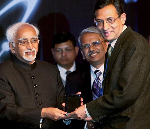In this Jan 4 2010 file photo Abhijit Banerjee receives from the then Vice President Hamid Ansari the Infosys Prize 2009 in Social Science Economics Category during a ceremony in New Delhi. | (File | PTI)