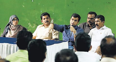Fort Kochi sub-collector Snehil Kumar Singh addresing residents at an awareness programme held by Maradu municipality on Sunday. (Photo | EPS/Arun Angela)