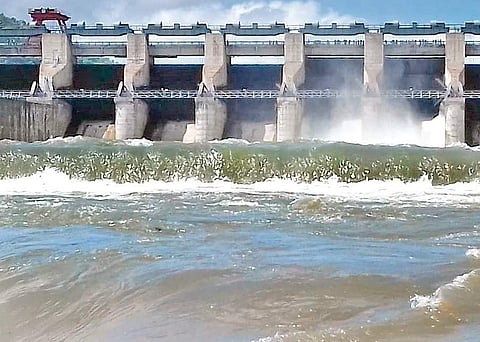 Srisailam dam officials lift four crest gates and release water downstream  Nagarjuna Sagar on Sunday I Express
