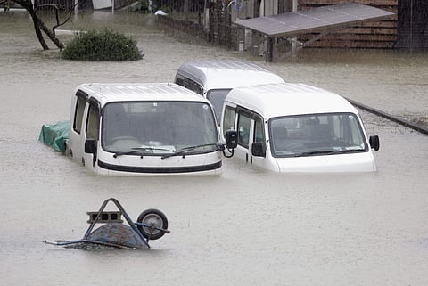 Cars sit submerged in water in the residential area hit by Typhoon Hagibis, in Ise, central Japan  (Photo | AP)