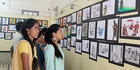 S Rajeshwari and R Gayatri look at their painting of Mahatma Gandhi| Express