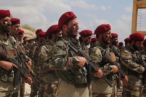 Turkish-backed forces from the Free Syrian Army, stand in formation during military maneuvers in preparation for a Turkish incursion targeting Syrian Kurdish fighters, near Azaz town, north Syria. (Photo | AP)