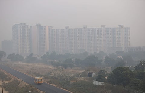 Under-construction high rise buildings are seen during a hazy morning in New Delhi on Tuesday. (Photo | EPS/ArunKumar)