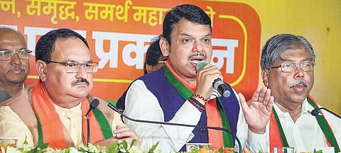 Maharashtra CM Devendra Fadanvis (centre) addresses the media as BJP working president JP Nadda and state BJP president Chandrakant Patil (R) look on, after the release of BJP’s manifesto in Mumbai | PTI