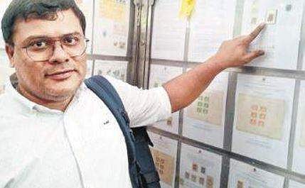 Prof MS Santosh shows his prized Red Scinde Dawk stamp I Express