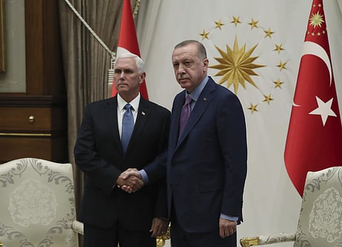 Turkish President Recep Tayyip Erdogan (R) shakes hands with US Vice President Mike Pence, prior to their talks at the Presidential Palace in Ankara, Turkey (Photo| AP)
