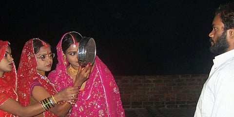 Krishna, a resident of Kashiram Colony in Chitrakoot's Lodhwara, got married to three sisters Shoba, Reena and Pinki 12 years ago. (Photo | IANS Twitter)