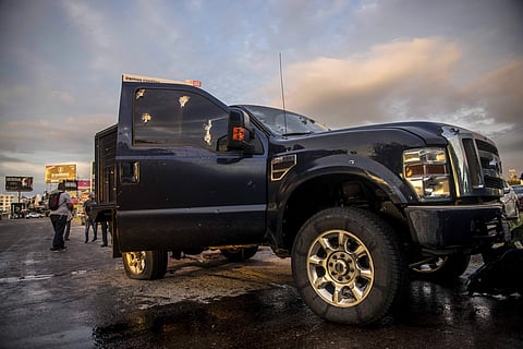 A truck's windows shows hits from bullets after a gunfight in Culiacan, Mexico. (Photo | AP)