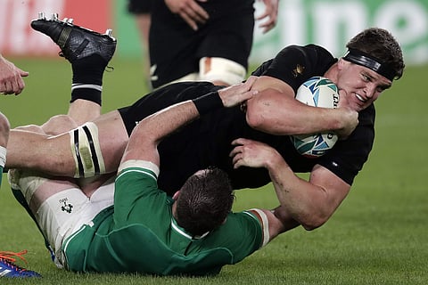 New Zealand's Scott Barrett is taken down by Ireland's Peter O'Mahony. (Photo | AP)