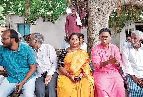 IICT retired scientist Dr K Babu Rao and IIPH Professor Dr V Ramana Dhara interact with the residents of Vemula mandal in Kadapa district on Friday | Express