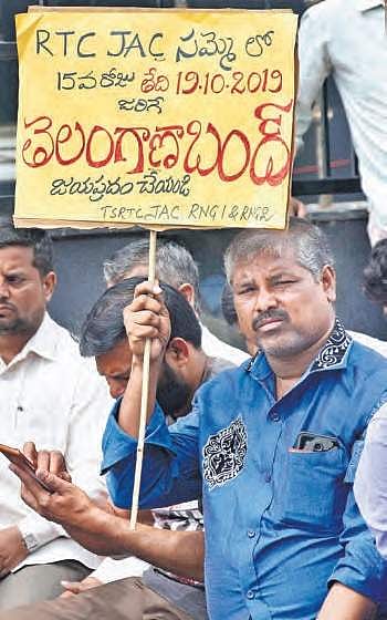 RTC workers holding a placard seeking support for Saturday’s bandh