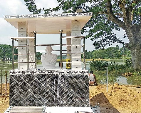 Statue of Mahatma Gandhi on the banks of Govari river at Barimula, (Inset) Bathing stone of Mahatma Gandhi at Dhumat village