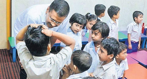 Chief Minister Arvind Kejriwal interacts with schoolchildren. | ( Photo | Twitter )