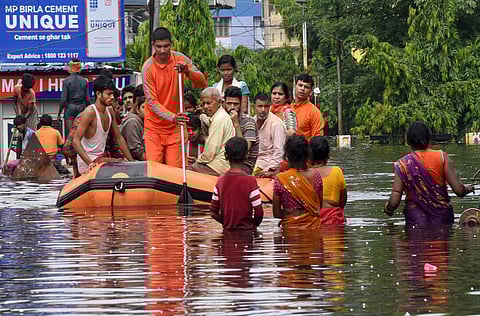 Patna National Disaster Response Force NDRF workers rescue people from flood-affected Bahadurpur area after heavy rains in Patna Tuesday Oct. 01 2019. (Photo | PTI)
