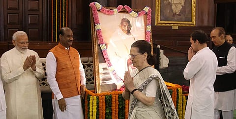 Prime Minister Narendra Modi, Congress interim president Sonia Gandhi, Rahul Gandhi and Lok Sabha Speaker Om Birla paying tribute to  Mahatma Gandhi on 150th birth Anniversary at Parliament house in New Delhi on Wednesday. | (Photo | Shekhar Yadav / EPS)