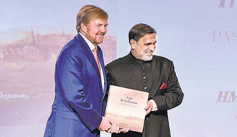 Netherlands’ King Willem-Alexander receives the first copy of a book titled ‘India and The Netherlands: Past, Present and Future’ authored by India’s Ambassador to The Netherlands Venu Rajamony, in The Hague, Monday | pti