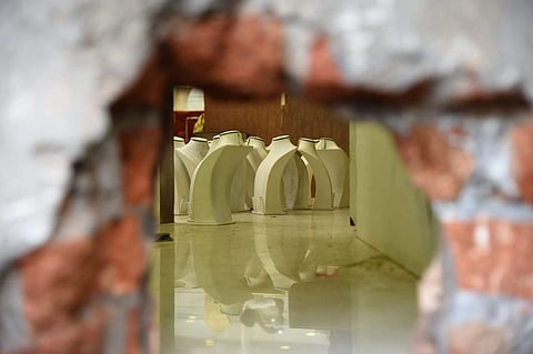 The burglars dug up a small-sized hole in the wall to gain entry into the shop. (Photo | M K Ashok Kumar, EPS)