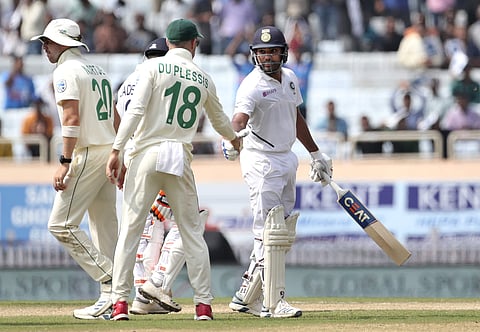 India's Rohit Sharma, right, is congratulated by South Africa's captain Faf du Plessis, center, on scoring a double century as he leaves the field after losing his wicket. (Photo | AP)