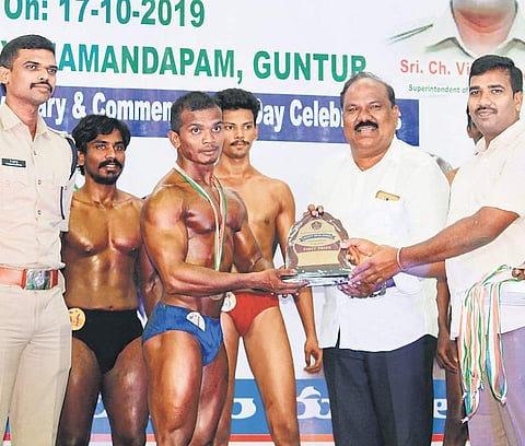 Guntur district Rural SP Ch Vijaya Rao presenting awards to the body-building competition winners (File Photo |EPS)