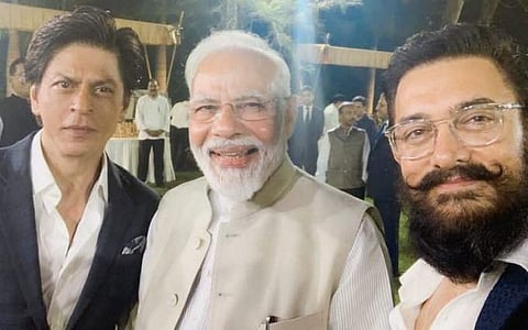 Bollywood actors Shah Rukh Khan and Aamir Khan with Prime Minister Narendra Modi. (Photo | Twitter)