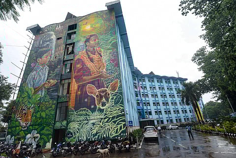 A view of murals on a wall of Bihar government's Vidyut Bhawan in Patna. The building has been transformed using huge murals depicting the theme of energy conservation. (Photo | PTI)